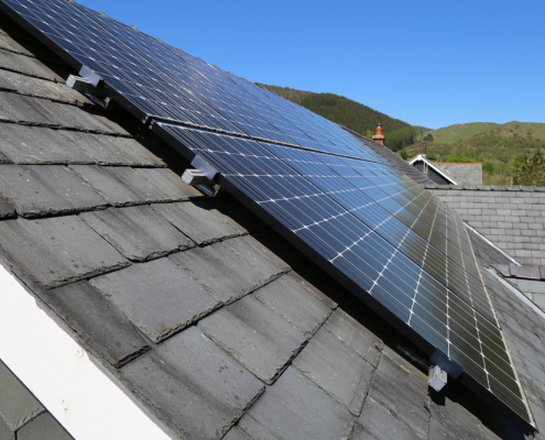 Domestic solar panels fixed to a slate roof Domestic solar panels fixed to a slate roof